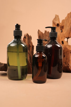 Cosmetic bottles on a wooden background. Skin care and treatment.
