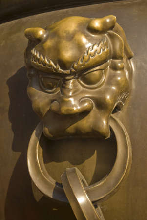 lion head door knob at Chinese templeの写真素材
