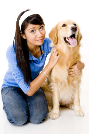 A pretty young asian woman with a big dogの写真素材