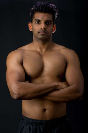 A muscular Indian man on black backgroundの写真素材