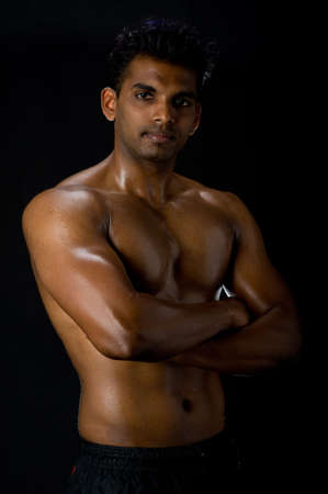 A muscular Indian man on black backgroundの写真素材