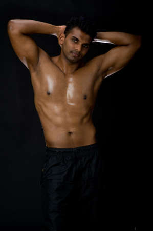 A muscular Indian man on black backgroundの写真素材