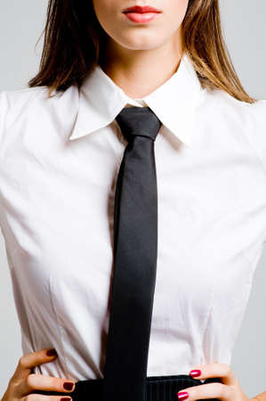 A young sexy businesswoman in blouse and tie