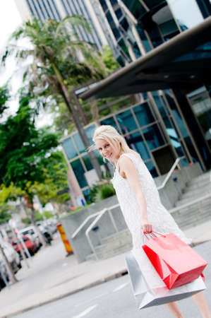 A beautiful young woman shopping in the city