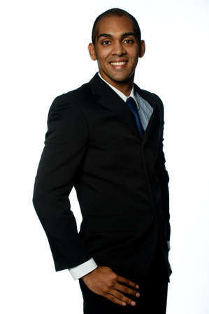 A confident young black businessman on white background