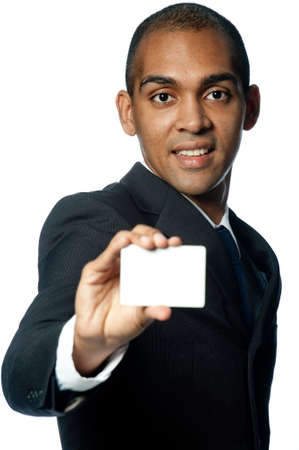A young black businessman holding out a blank card on white backgroundの写真素材
