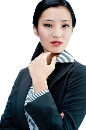An attractive Asian businesswoman in a suit on white backgroundの写真素材
