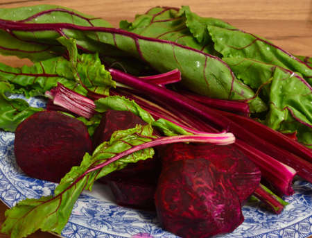 Young beetroots with leafs on a plate.の写真素材