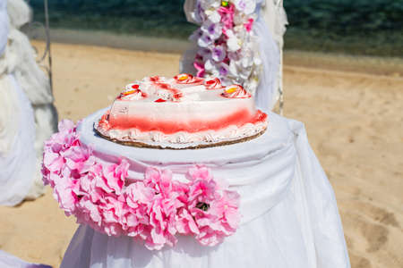 set of accessories for a wedding on the shores of the Caribbean Sea. Arch decorated with flowersの写真素材