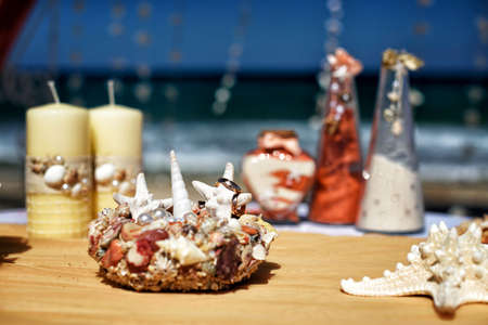 There is accessory kit for a wedding with sea attributes on the background of the Caribbeanの写真素材