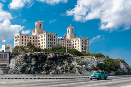 HAVANA, CUBA - May 15, 2016: Hotel National in the center of Havana. Flag of Cuba is flying on the wind. Retro car is riding on the street.のeditorial素材