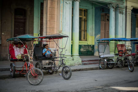 HAVANA, CUBA - May 16, 2016: Taxi drivers are waiting for a passengers. Working day in Havana. There...