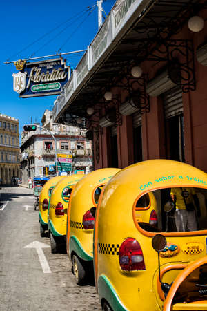 HAVANA, CUBA - May 19, 2016: Hot summer day in the capital of Cuba. Funny local coco taxies are parked in the street. View to part of the area of Old Havana.のeditorial素材