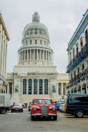 HAVANA, CUBA - MAY 16, 2016: View to the Capitol. Retro car is riding on the street of Havana.のeditorial素材