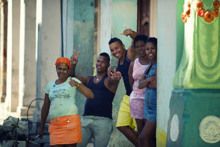 HAVANA, CUBA - May 18, 2016: Locals of Cuba welcome the tourists. Residents are on the street of Havana.のeditorial素材
