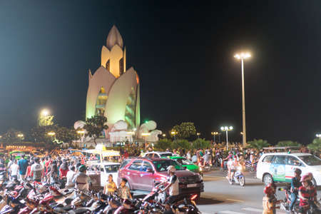 NHA TRANG, VIETNAM - JUNE 19, 2016: Populous illuminated tourist street with the high-rise building of unusual architecture in the downtown in Vietnamのeditorial素材