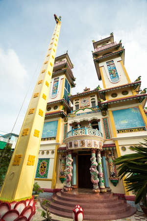HO CHI MINH CITY, VIETNAM - JUNE 26, 2016: View of an entrance to Buddhist temble with two big towers and unusual architecture. Sculptures of dragons and Buddhist deity are upon the bulding.のeditorial素材
