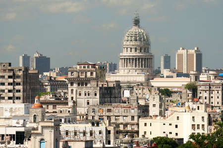 HAVANA, CUBA - OCTOBER 03, 2016: View of the cityscape at summer sunn day. The reconstructed Capitol and architecture of old, ancient ragged houses of Havana.のeditorial素材