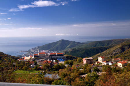 KOTOR, MONTENEGRO - NOVEMBER 15, 2014: Clear blue sky in Montenegro. Bright sunny day at the top of the mountain. Landscape down to the city and costline of the sea.のeditorial素材
