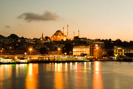 ISTANBUL, TURKEY - JUNE 22, 2015: View from the sea on the waterfront in Istanbul at nighttime. In the background there is the main SÃÂ¼leymaniye Mosque.のeditorial素材