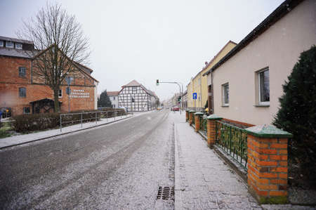 WUSTERHAUSEN, GERMANY - December 11, 2015: View to empty street of the small town in Germany. To the left side there is a small hotel, and to the right the houses of local residents.のeditorial素材
