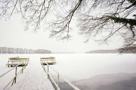 WUSTERHAUSEN, GERMANY - December 11, 2015: View to the frozen pier and the river Dosse on a winter day.のeditorial素材