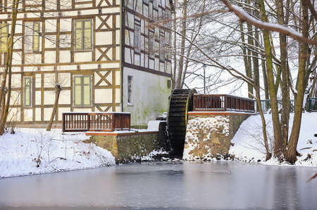 WUSTERHAUSEN, GERMANY - December 11, 2015: View to river, old watermill and house on the shore on a winter day.のeditorial素材