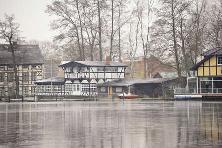 WUSTERHAUSEN, GERMANY - November 05, 2015: View from the river Dosse to the houses on the shore of Wusterhausenのeditorial素材