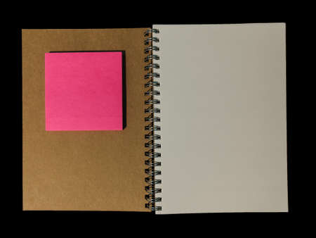 Clear color note book opened for note or lecture note or memo for remine and brown cover whit pink...