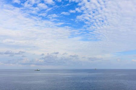Blue sea and blue sky with white cloud Panorama Blue sea and blue sky with white cloud in oil and gas platform background.の写真素材