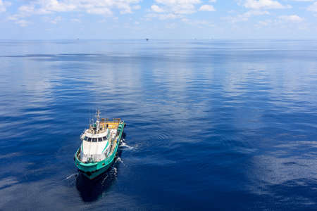 GULF OF THAILAND,OCTOBER 18,2017: Offshore oil and gas crew boat approach to the platform for transfer passenger between crew boat and platform.のeditorial素材