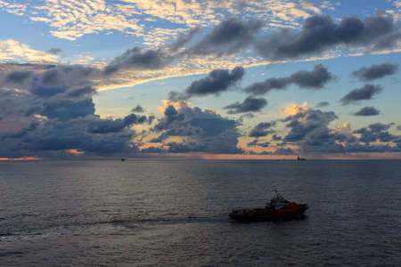 GULF OF THAILAND,OCTOBER 25,2017: Offshore oil and gas crew boat approach to the platform for transfer passenger between crew boat and platform.のeditorial素材
