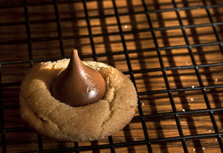 A sweet delight on the cooling rack waiting to be tasted   Baking homemade cookies at Christmas is a family tradition with us の写真素材