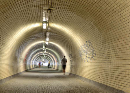 long tunnel in Prague between districts Zizkov a Karlin with walking peopleのeditorial素材