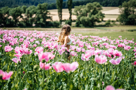 Girl with curly long blonde hair standing in Aの写真素材