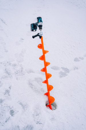 Orange Fishing Drill Stuck In Iceの写真素材