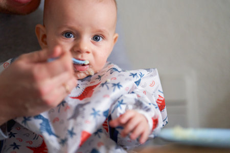 the first complementary feeding of a babyの写真素材
