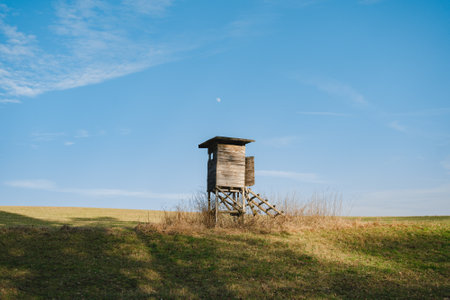 A hunting tower is a tall structure in a fieldの写真素材