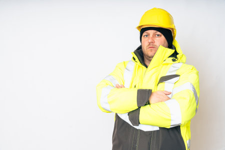 a man wearing a yellow working winter jacket and aの写真素材