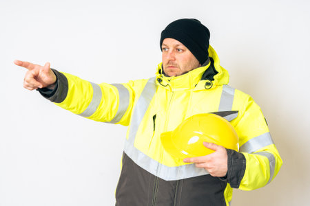 a man wearing a yellow working winter jacket and aの写真素材