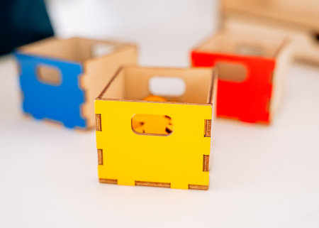 Three boxes: red, yellow and blue with geometricの写真素材