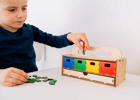 A little boy of 4 years old is arrangingの写真素材