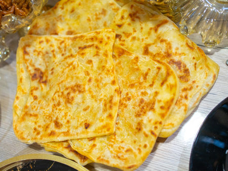 Golden Flatbreads on Wooden Table Perfect forの写真素材