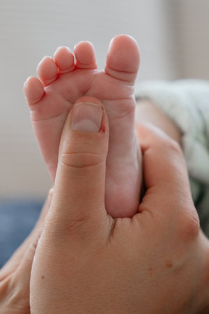 Pure Connection: Hands and Baby Feetの写真素材