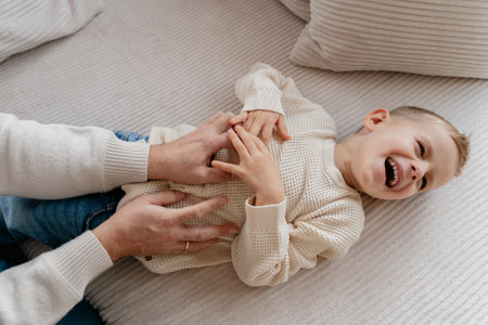 Close-up of a 4-year-old boys face laughing fromの写真素材