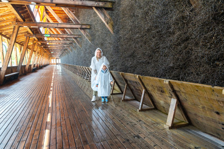 Exploring Salt Graduation Tower in Raincoatsの写真素材