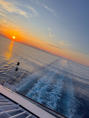 Sunset cruise view over the sea from ship deckの写真素材