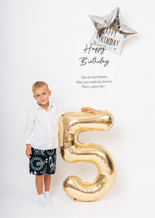 Happy 5th Birthday Celebration with Giant Goldの写真素材