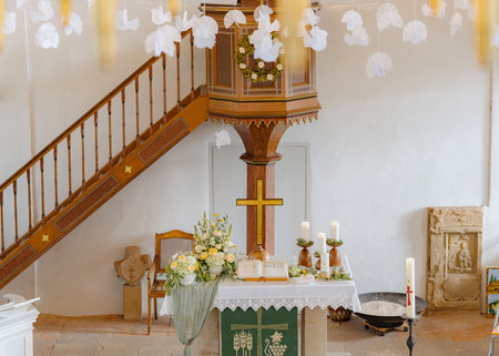 Church Altar Decorated with Flowers and Candlesの写真素材