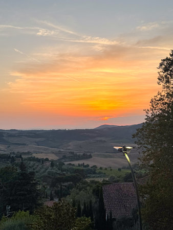 Captivating Rural Sunset Over Rolling Hills andの写真素材